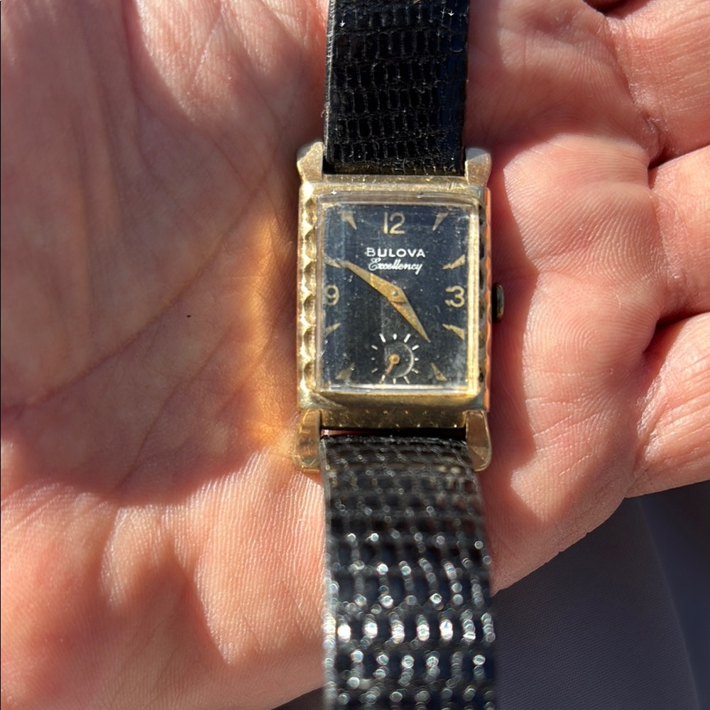 Bulova Gold and Black Retro Tank-Style Automatic Watch.